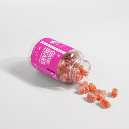 GlowBEARS Multivitamin Gummies for daily wellness in a colorful jar with gummies spilled out.