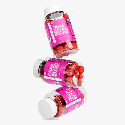 GLOWBITES Hair Skin and Nails Gummies bottles with colorful labels stacked in a creative arrangement.